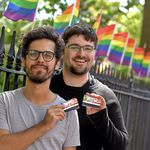 People holding the MTA's WorldPride MetroCard (MTA Photos)